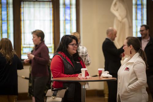 Two Southeast staff members interact during Faculty and Staff donuts for I Love SEMO Week.