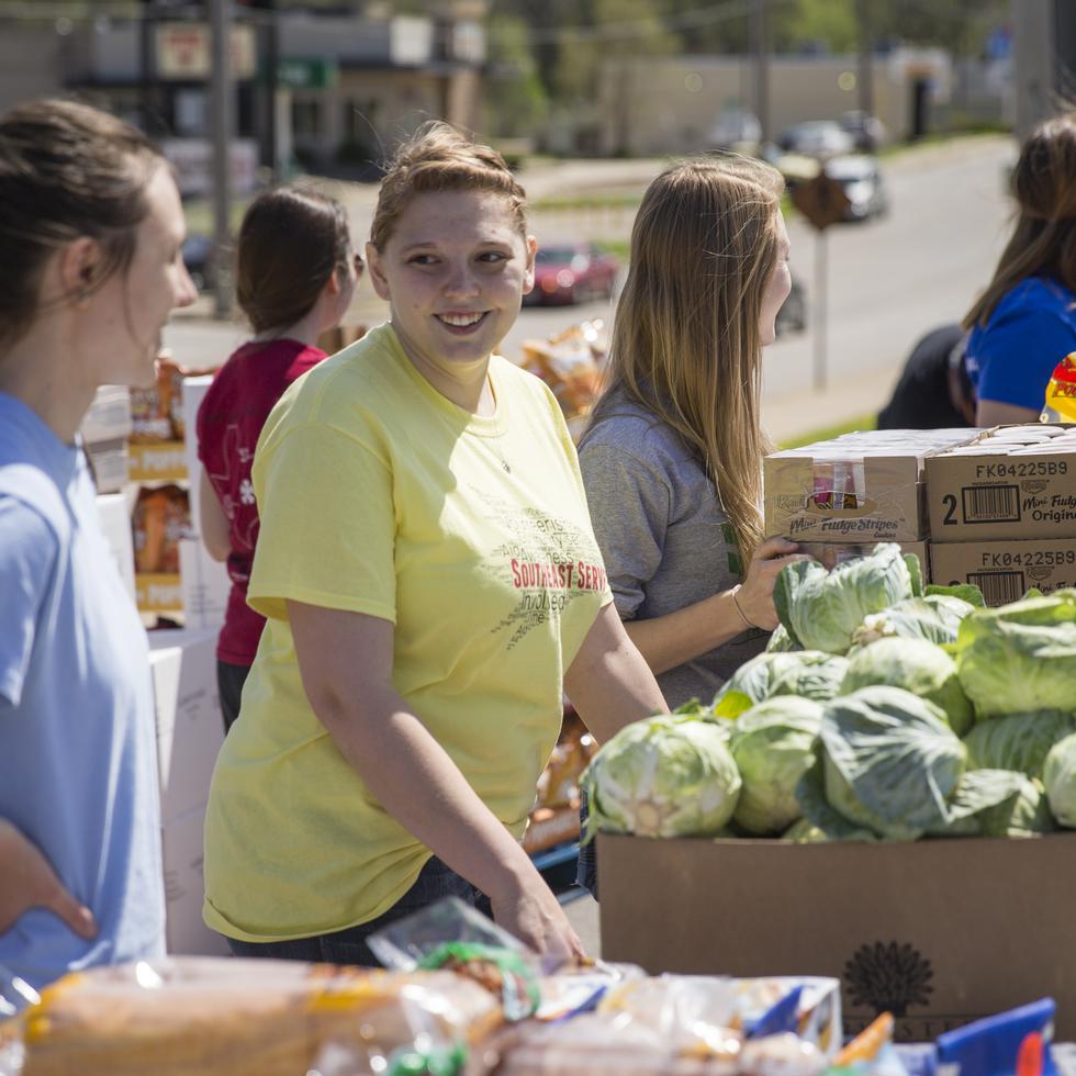 A group of Southeast students wait to hand out food during a Southeast Serves event.