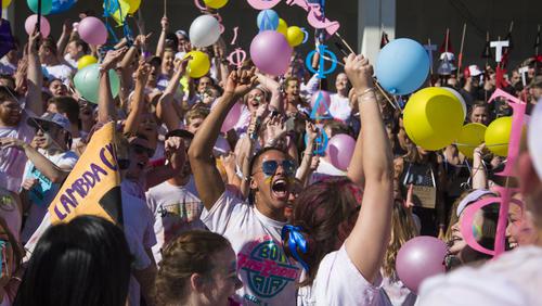 Student cheers from the crowd during Chariot Race event.