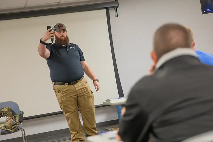 A SEMO criminal justice faculty member gives a demonstration in class.
