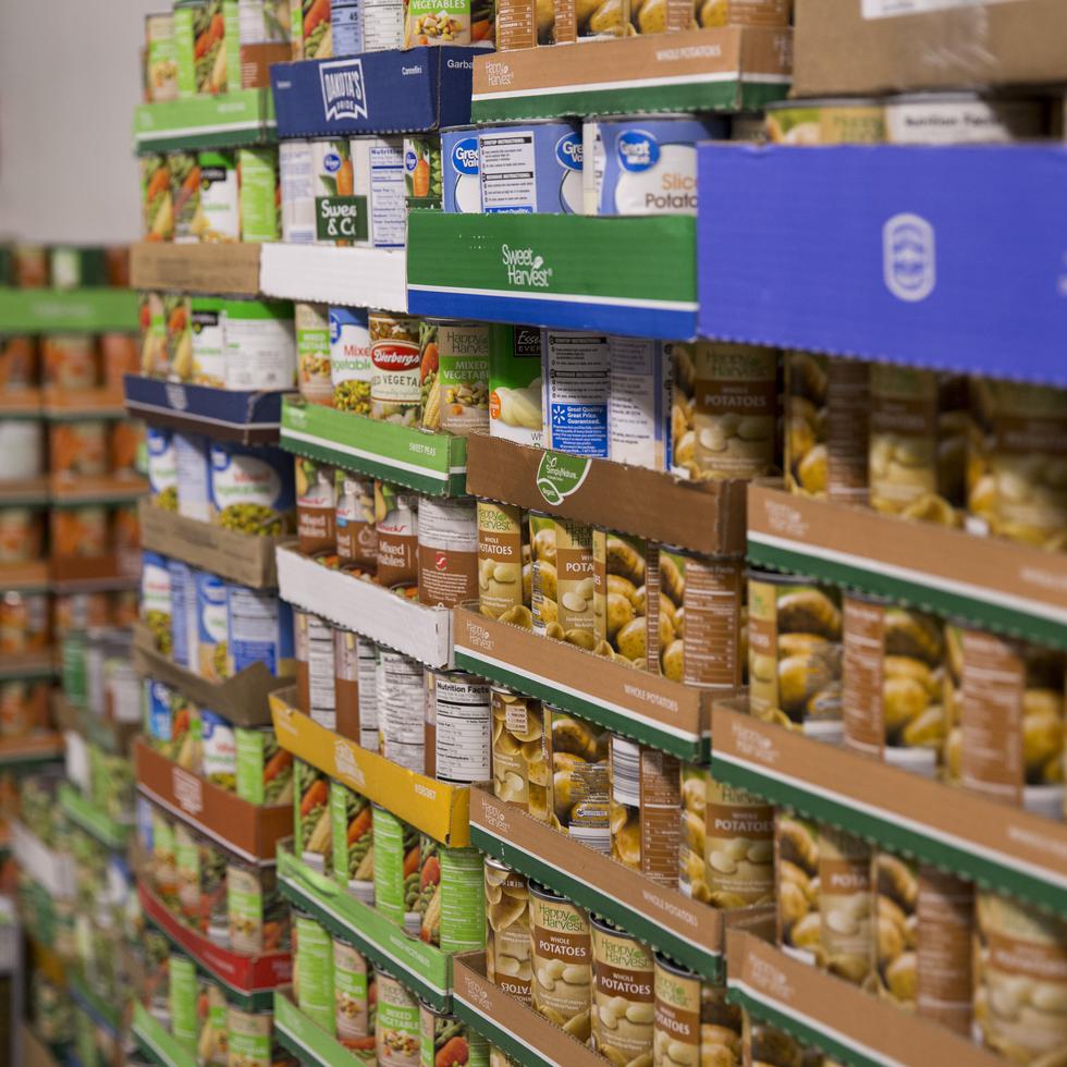 Canned food is stacked inside the Redhawk Food Pantry in Kent Library.